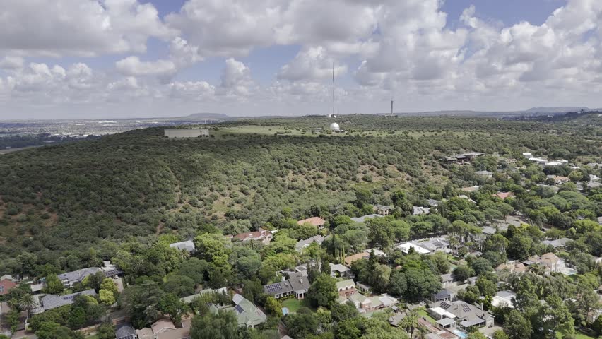 Drone orbits left from north to east side of Naval Hill on sunny afternoon in Bloemfontein, South Africa