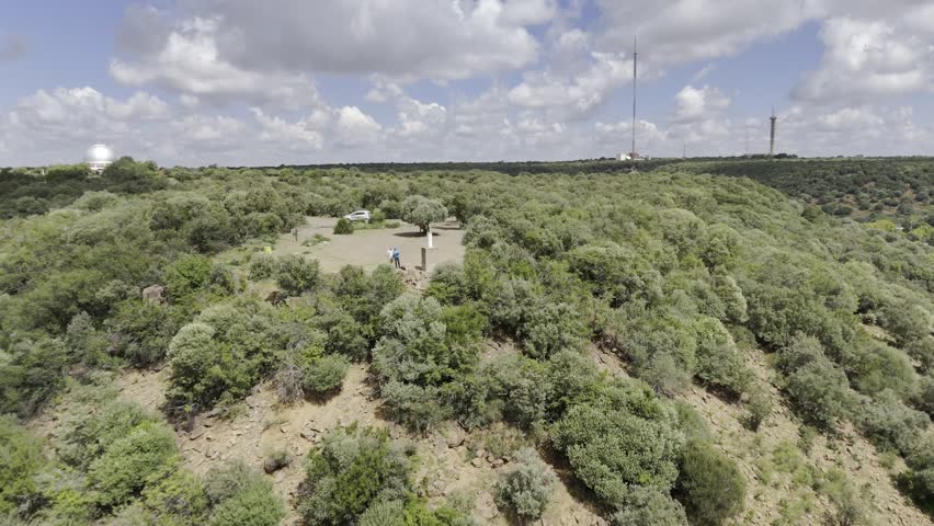 Drone flies backwards going northeast from Naval Hill on sunny afternoon in Bloemfontein, South Africa
