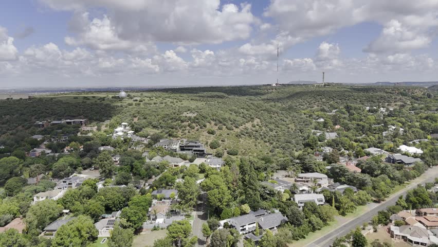 Drone orbits to the left along north side of Naval Hill on sunny afternoon in Bloemfontein, South Africa