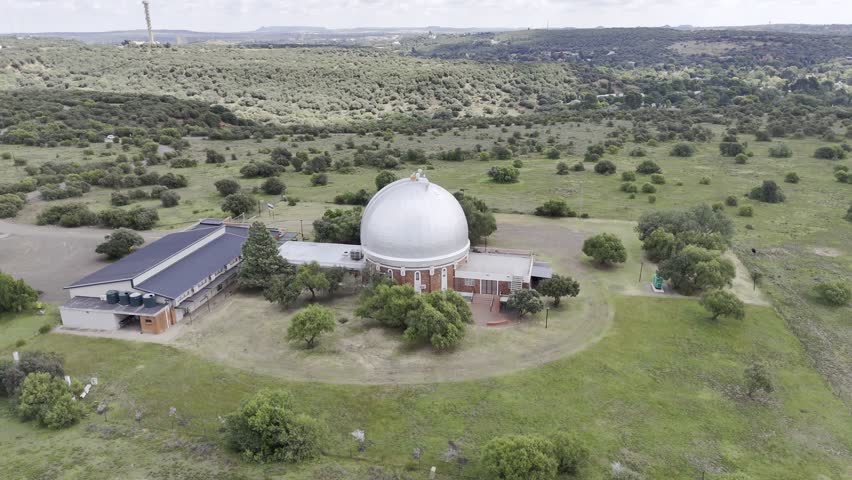 Drone does 360 around planetarium atop Naval Hill on a partially cloudy Sunday afternoon in Bloemfontein, South Africa