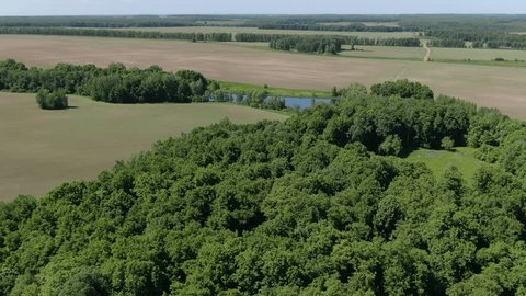 Drone Flying around River Valley Green Fields