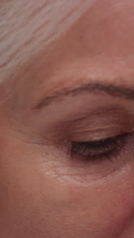 Senior old woman eyes, test or assessment of vision, eyesight and optometry for elderly patient. Eye, closeup and lady thinking with wrinkles, natural skin. Macro shot of natural aging features.