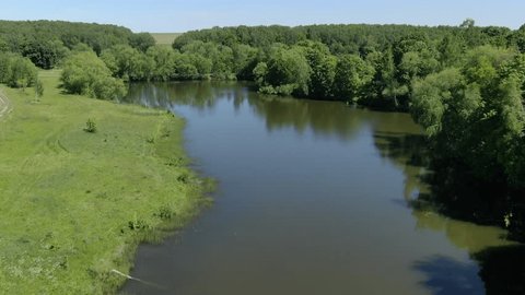Drone Flying Forward above Lake Trees