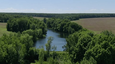 Aerial Drone Orbiting River Rising above Landscape