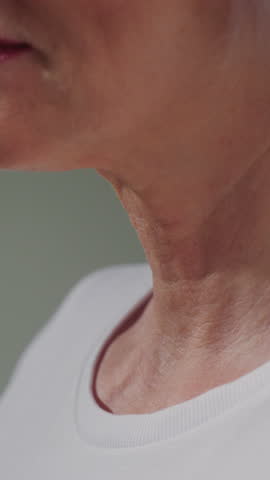 Elderly woman neck and good teeth smile. Old female tightens and stretches chin perfect skin. Care for senior persons medicine and treatment. Cosmetology or dermatology for wrinkles. Close up macro
