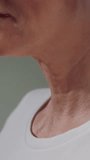 Elderly woman neck and good teeth smile. Old female tightens and stretches chin perfect skin. Care for senior persons medicine and treatment. Cosmetology or dermatology for wrinkles. Close up macro - Powered by Shutterstock - Get 15% off with code: PIKWIZARD15