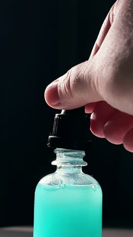 Blue Copper peptides skin repairing serum in transparent bottle. Face and skin beuty routine themes