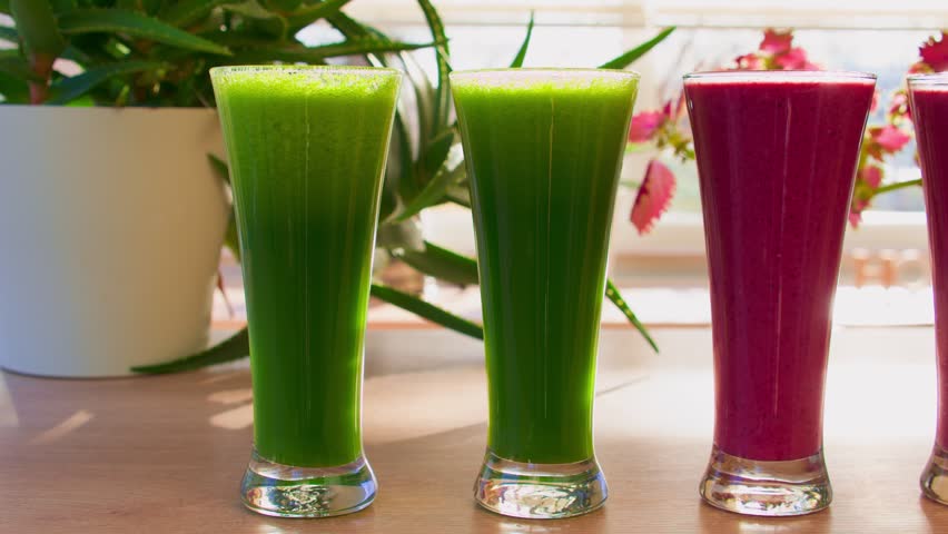 Green and Purple Raw Smoothies with Fruits