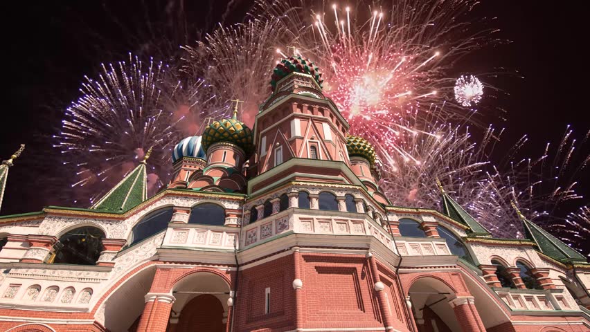 Temple of Basil the Blessed and fireworks in honor of Victory Day celebration (WWII), Red Square, Moscow, Russia. Time lapse 