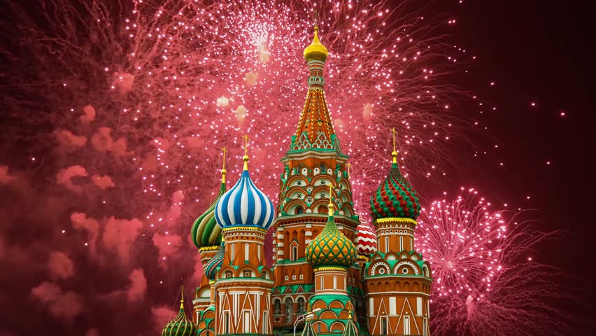 Temple of Basil the Blessed and fireworks in honor of Victory Day celebration (WWII), Red Square, Moscow, Russia. Time lapse 