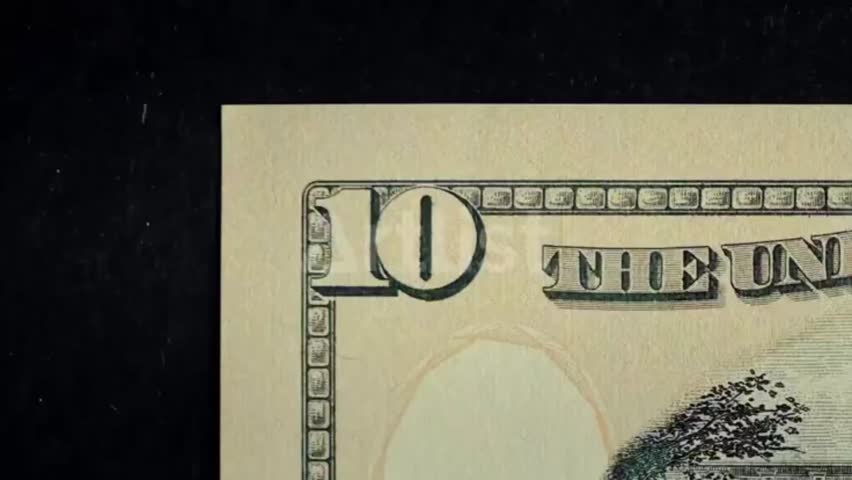 A close-up video of multiple dollar bills - Match cut effect video on dollar bills.