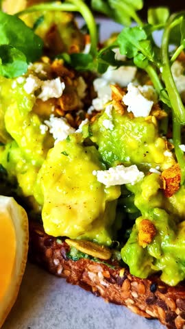Vertical view of avocado toast breakfast in Bali Indonesia, healthy tropical cafe food lifestyle