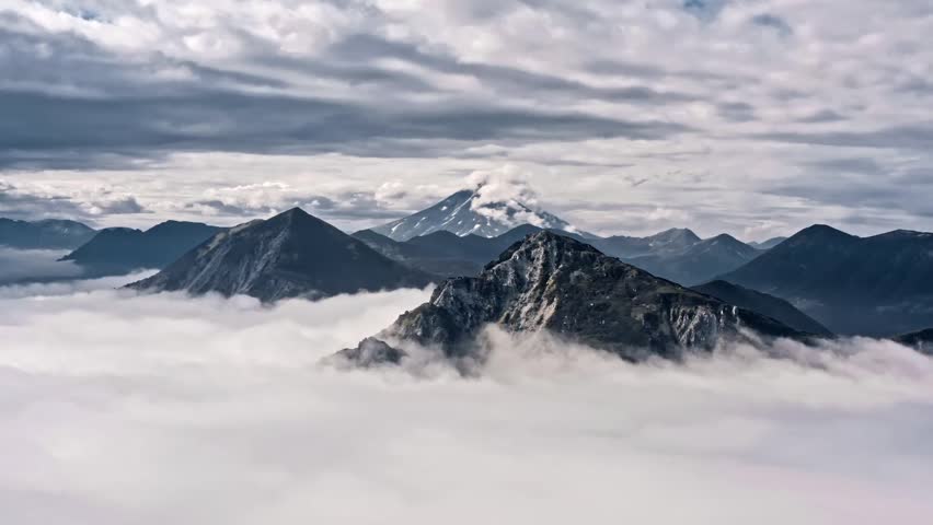 4K Breathtaking Mountain Landscape Surrounded by Clouds and Mist