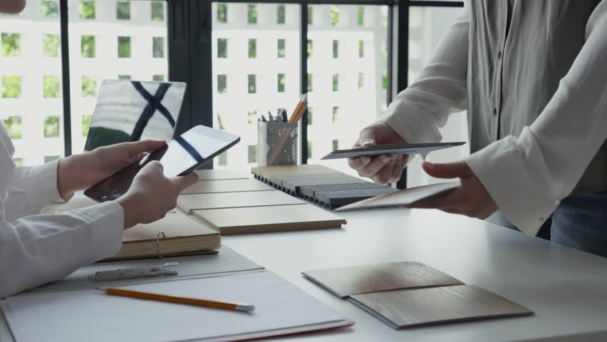 Two Interior Designers Collaborating in Office.