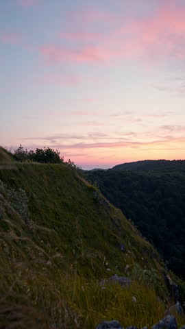 Peaceful sunrise over lush hills, serene mood and vibrant colors