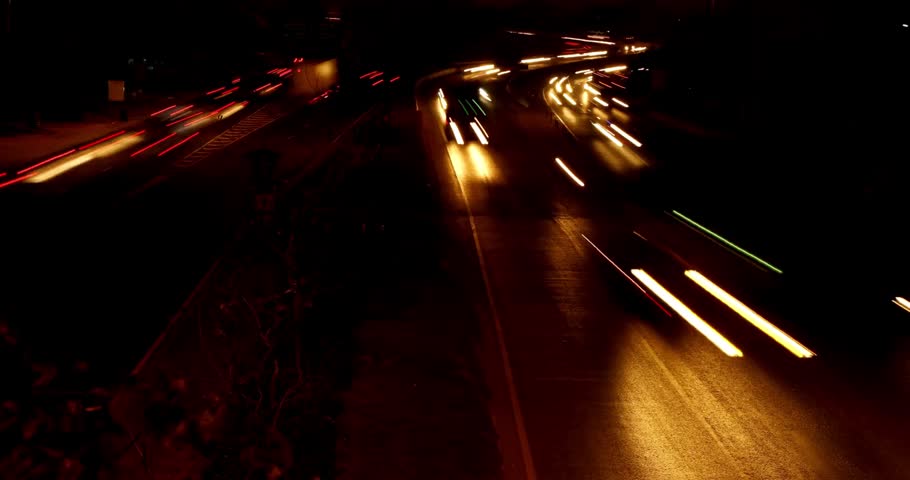 Time lapse of freeway busy city road during rush hour fast moving freeway traffic at night showing cars with light streaks 4k HD
