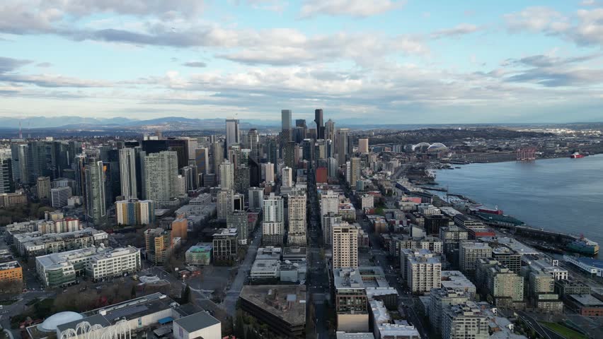 Space Needle and downtown seattle skyline in spring evening drone aerial
