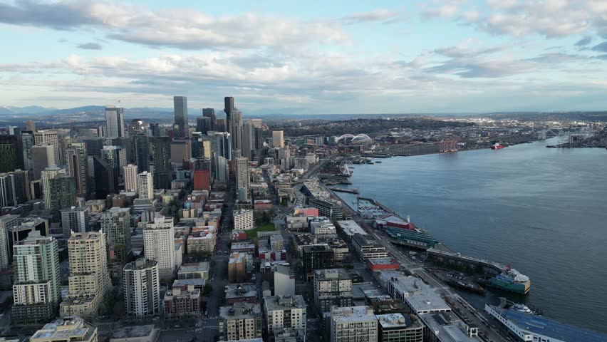 Space Needle and downtown seattle skyline in spring evening drone aerial