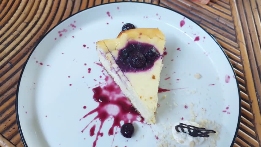 Delicious blueberry cheesecake with bluebery jam and fruit, top down view