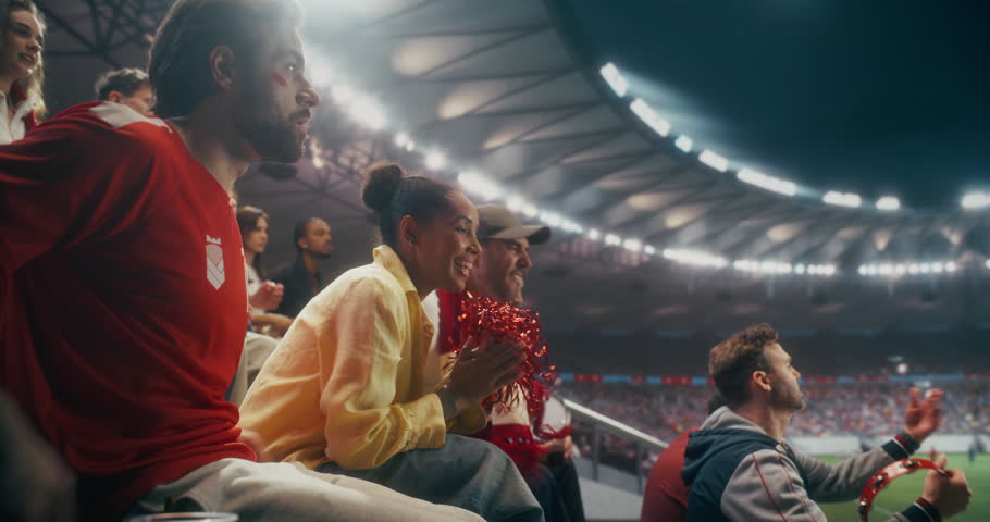 Portrait of Happy Multicultural Soccer Fans Cheering and Applauding in a Packed Stadium During a Professional International League Championship Match, With Confetti and Scarves, Slow Motion.