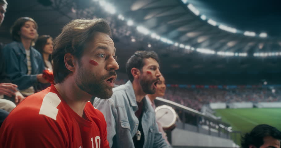 Portrait of a Happy White Male Soccer Fan Smiling and Celebrating With Friends in a Packed Stadium During a Professional International League World Event Championship Match, Slow Motion.