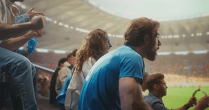Close-up of Joyful Soccer Supporters in a Packed Stadium During a Professional International League Match, With a Smiling Young Black Couple in Clapping as the Crowd Celebrates Victory. - Powered by Shutterstock - Get 15% off with code: PIKWIZARD15