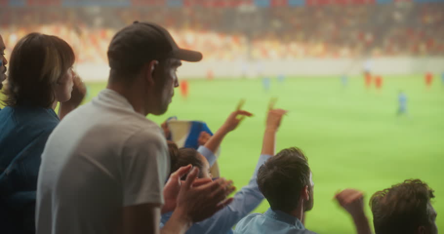 Diverse Happy Soccer Fans Celebrate Together in a Packed stadium Cheering for Their Team During a Professional League Match and Major International Tournament, With a Lively Crowd and Field View.