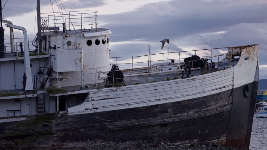Old Fishing Boat Wreck in Coastal Port