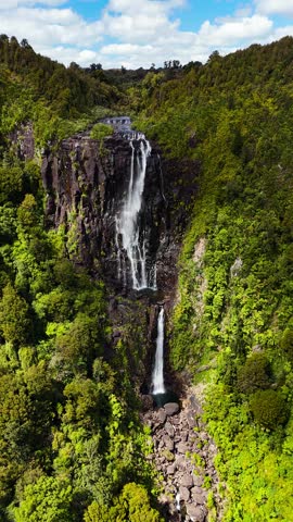 Wairere Falls in New Zealand. Aerial Vertical Dolly Out View