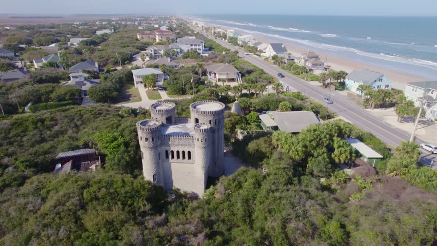 Vertical drone shot looking straight down at the emerald green lawn and stone bastions of the fort.