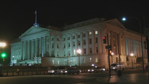 WASHINGTON, DC - CIRCA 2012: Lone figure walking up steps at mid-clip. United States Treasury Department building is the oldest departmental building in DC, at  corner of 15th St and Pennsylvania Ave.
