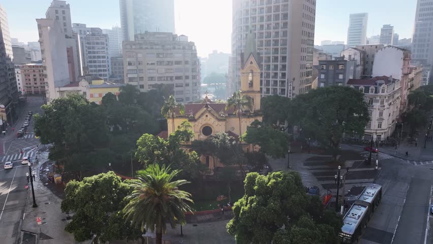 Paissandu Square In Sao Paulo Brazil. Stunning Baroque Church Contrasts With The Landscape . Business Clouds Sky Downtown Cityscape. Outside Downtown Panning Wide. Sao Paulo Brazil.