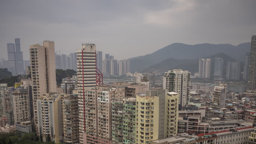 macau skyline of towers on cloudy day