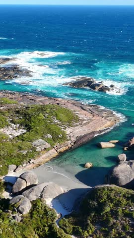 Vertical aerial drone view of Elephant Rocks Beach and Elephant Cove. William Bay National Park near Denmark. Stunning natural rock formations surrounded by turquoise waters.	