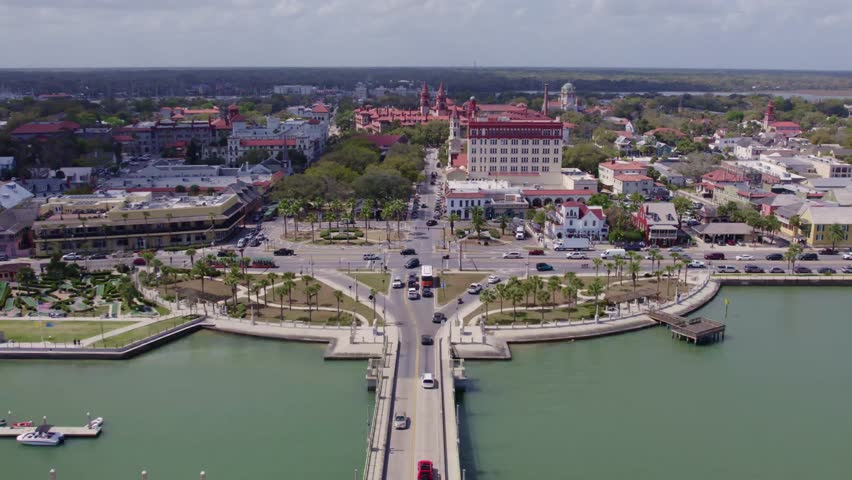 Wide-angle aerial capture of the St. Augustine Lighthouse standing tall over the Atlantic coast.