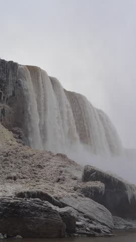 Wide winter view of waterfall and mist at Niagara Falls