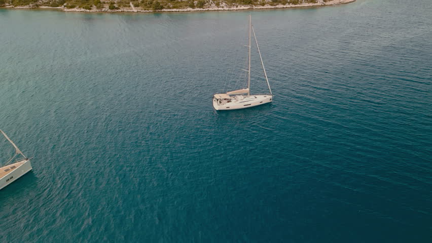 Calm Boats Rest In Harbor. Peaceful Maritime Scene With Shimmering Water And Anchored Yachts