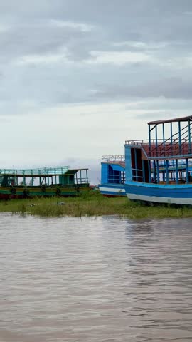 Large Wooden Boats on Grassy Lakeshore (Kampong Phluk, Cambodia)