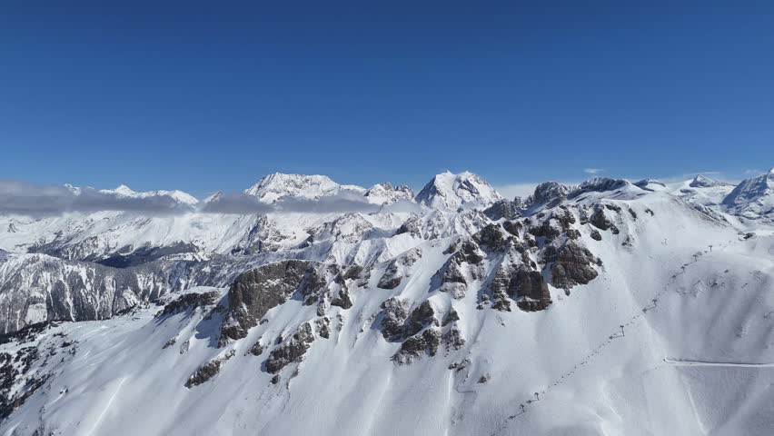 Aerial view of snowcapped French alps by winter shot with drone