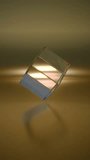 4K vertical video seamless loop animation of a 3D glass prism cube rotating on a golden background. Luxury premium crystal concept. - Powered by Shutterstock - Get 15% off with code: PIKWIZARD15