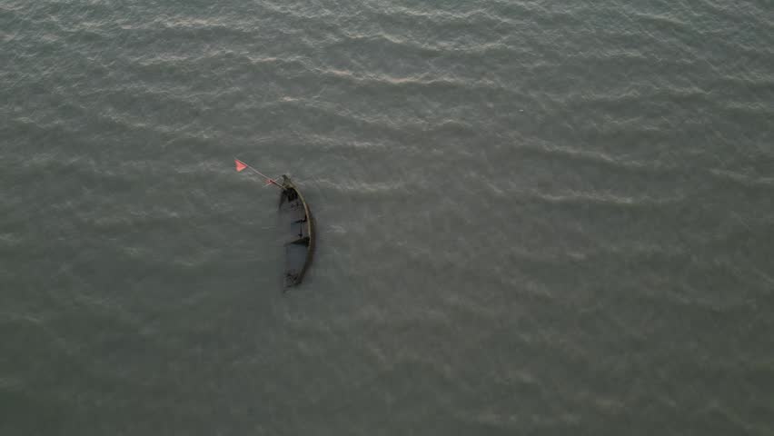 Title: Traditional Fishing Boats Anchored in Golden Sunset Glow at Bang Saen Beach, Thailand
