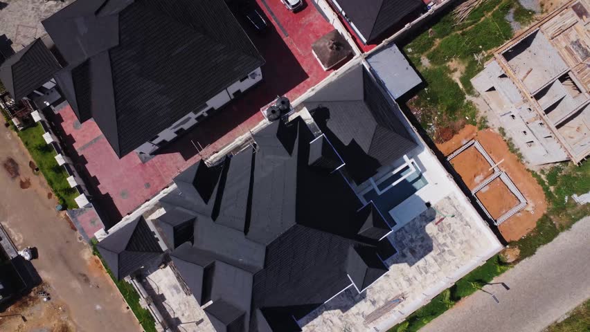 Top down aerial of a expensive luxury home in a peaceful suburban neighborhood in Abuja, Nigeria