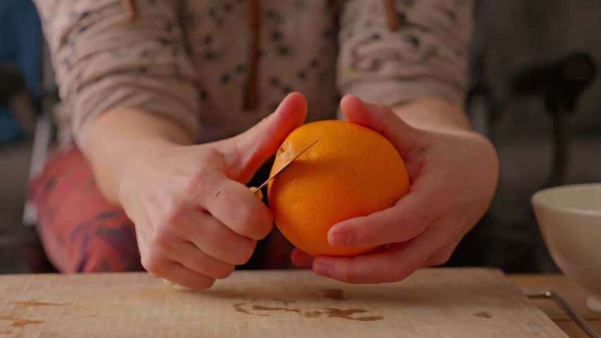 Peeling a Fresh Juicy Orange
