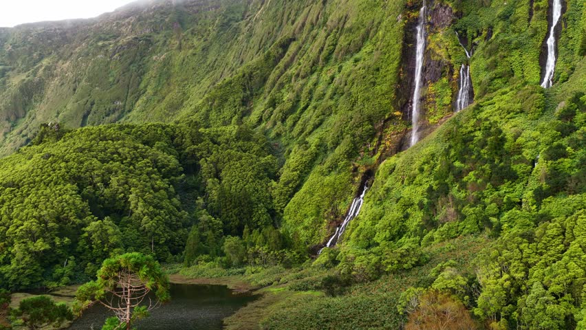 scenic jungle waterfall on Flores island in the Azores, Portugal, Atlantic Portuguese archipelago, wildlife adventure in the Azores