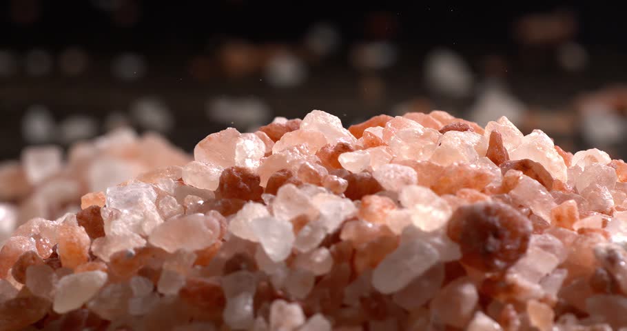 Himalayan pink salt in a super slow motion, natural mineral seasoning for healthy cooking and spa concepts. Super slow motion 1500 fps.