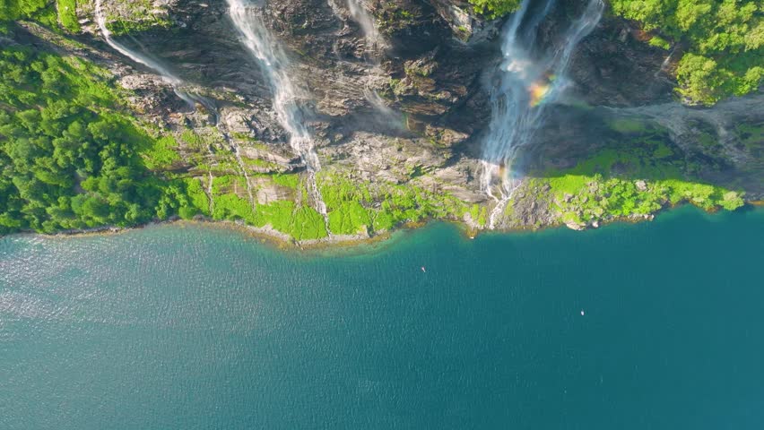 Seven Sisters Waterfall, Geiranger Fjord, Norway. Nature in fjords. Traveling through the Norwegian fjords. Scandinavia. View of nature from the drone. Vacation and travel in summer Norway.