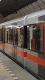 Vertical Modern Subway Train Arriving at Underground Metro Station Platform, Urban Public Transport, City Infrastructure, Passenger Reflections, Clean Contemporary Transit, Slow Motion 4K - Powered by Shutterstock - Get 15% off with code: PIKWIZARD15