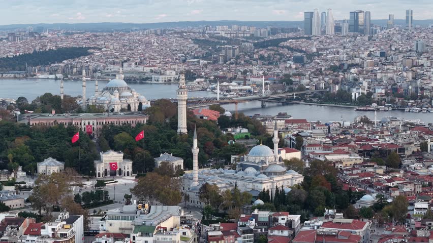 Aerial panoramic view: Beyazıt Square, Beyazıt Tower, Beyazıt II Mosque, Süleymaniye Mosque, Istanbul University, Golden Horn bridges and distant skyscrapers (Istanbul Old City)