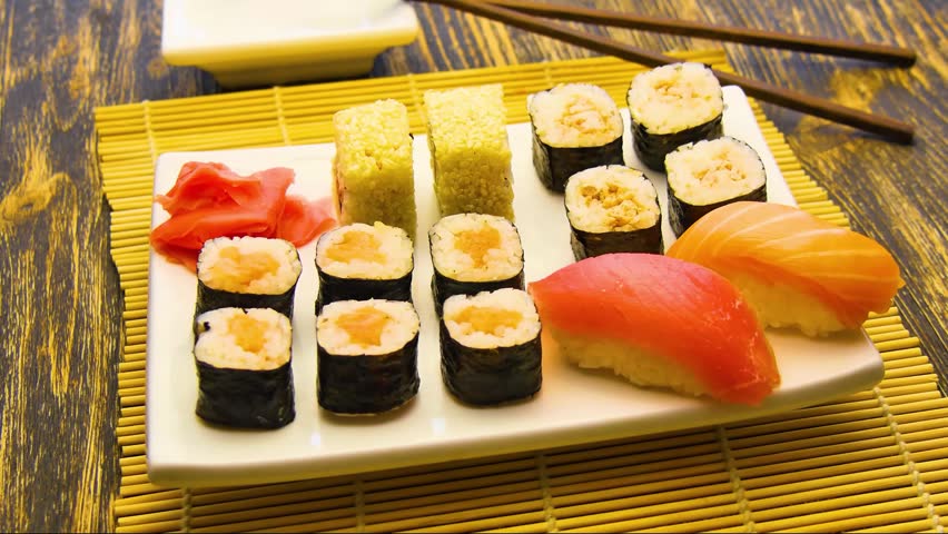Assorted sushi platter with nigiri and rolls.