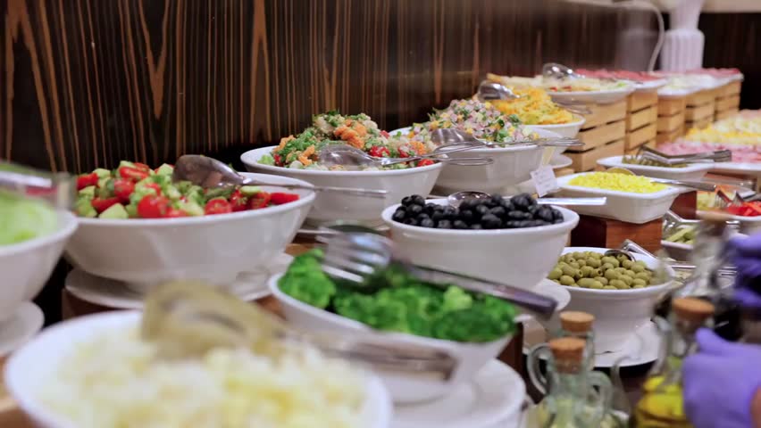 Hotel food court showcasing diverse breakfast options with fresh dishes, buffet spread, and inviting dining atmosphere for guests.